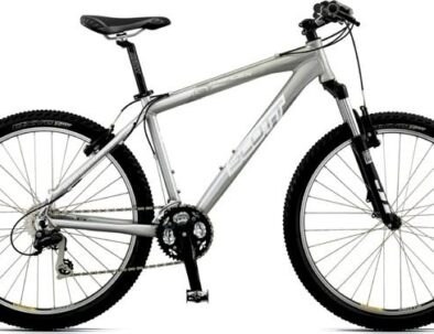 Silver mountain bike with black tires and a front suspension.