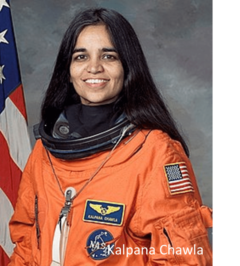 Person in orange NASA spacesuit with USA flag patch, flag in background.